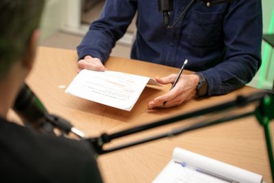 Professional podcast microphone with green lighting